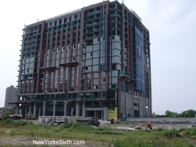 Windows are being installed on the northern facade of the Gulls Cove condominium tower
