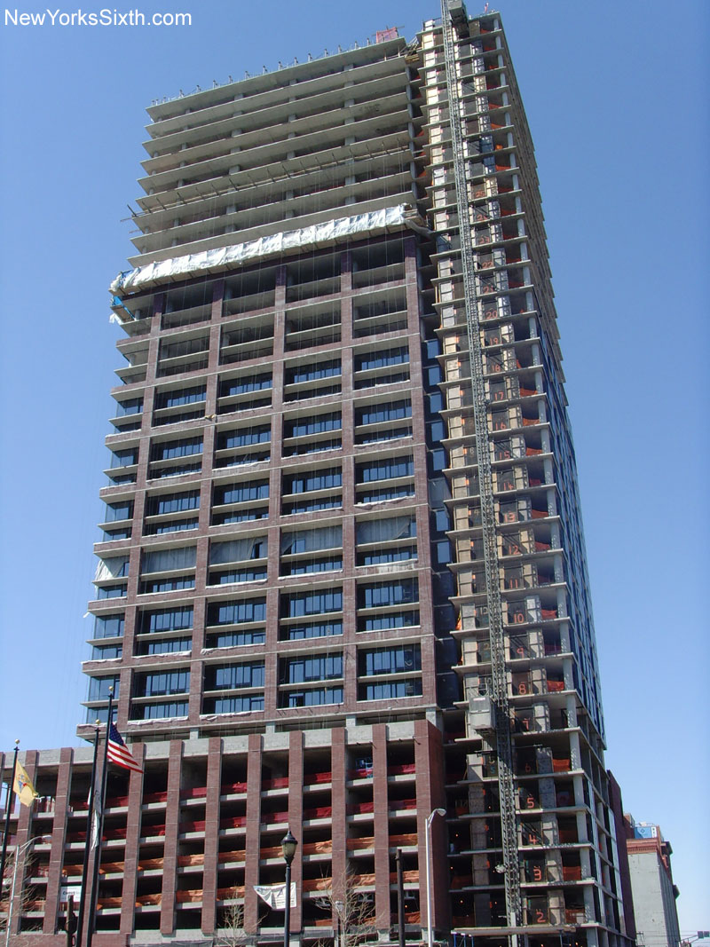The Athena Tower in Jersey City plays on the industrial shapes of the warehouse district to the south and west of the tower