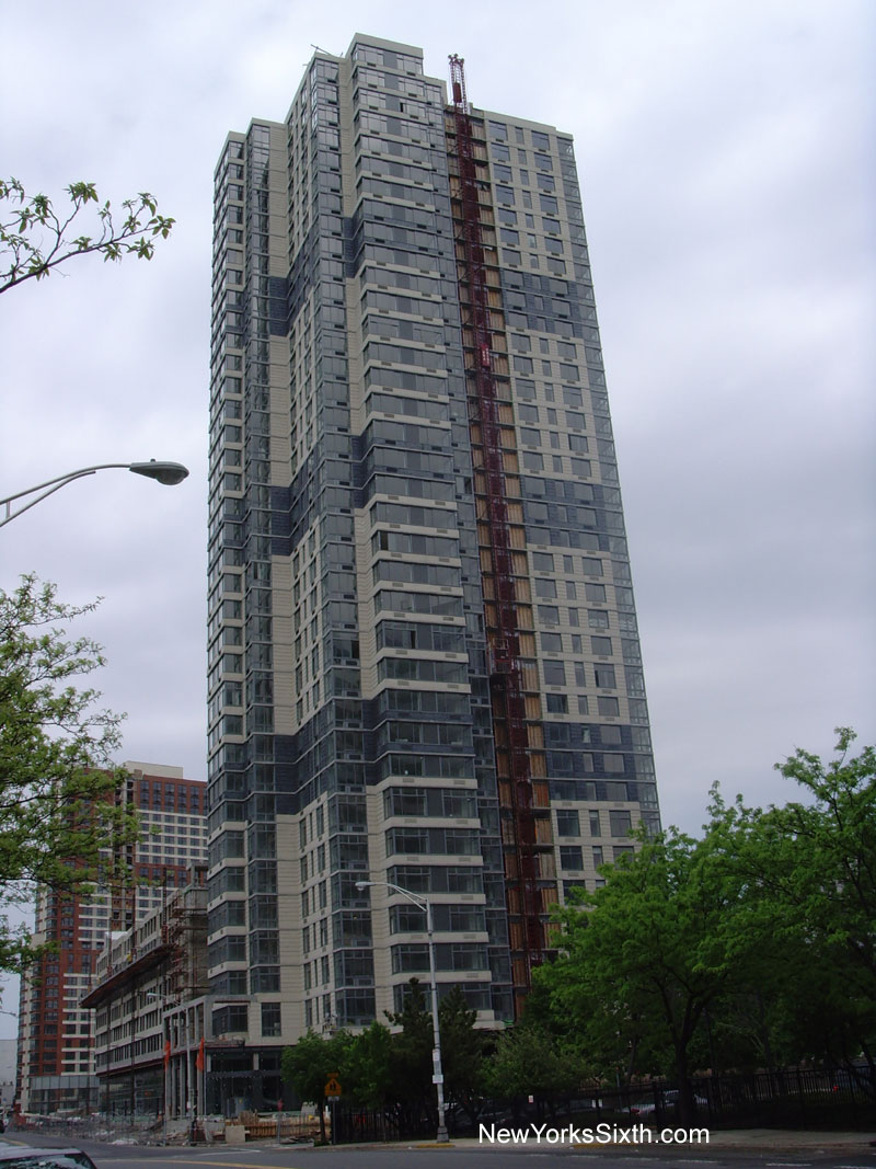 Columbus Tower is a luxury rental apartment tower with retail stores in the base along Columbus drive in Jersey City